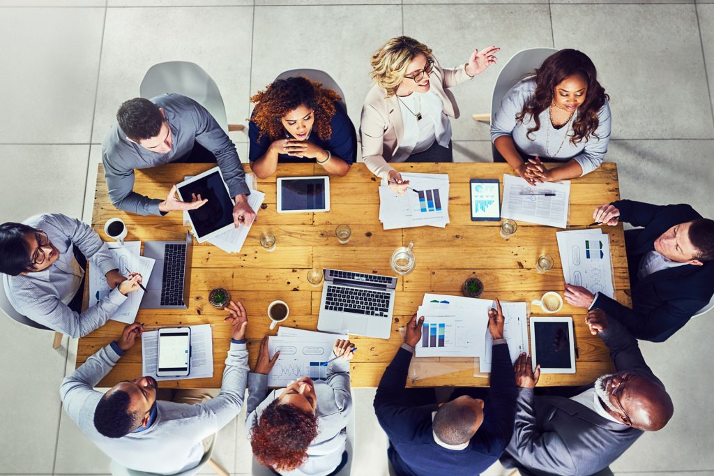 High angle shot of a group of businesspeople having a meeting in a modern office.